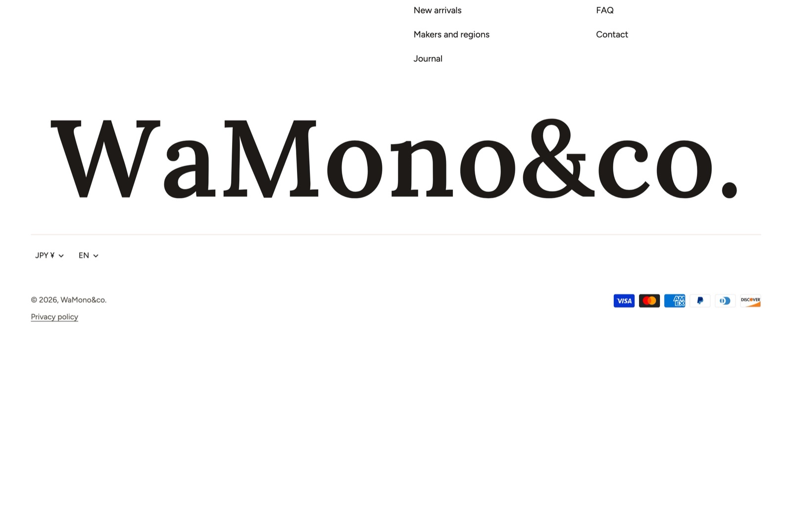 The footer in the demo store: two menu columns, the email signup and the shop name set large across the bottom edge