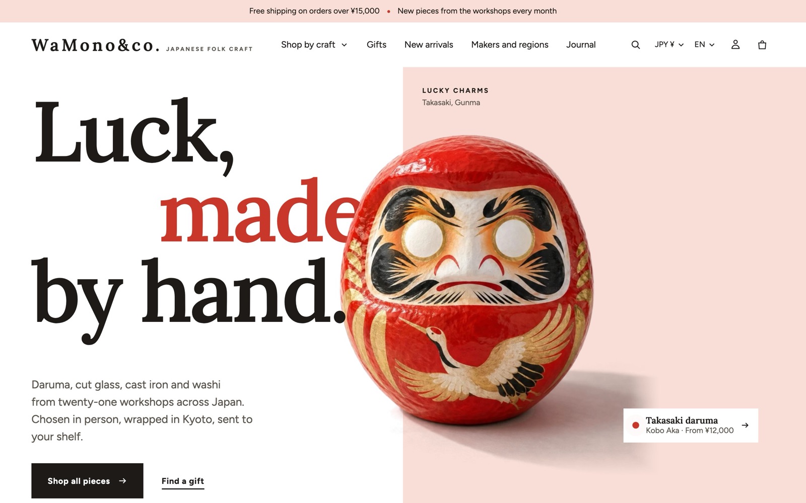 The top of the Kyoto demo store: the interlocking hero with the headline “Luck, made by hand.” and a red daruma on a pale pink field