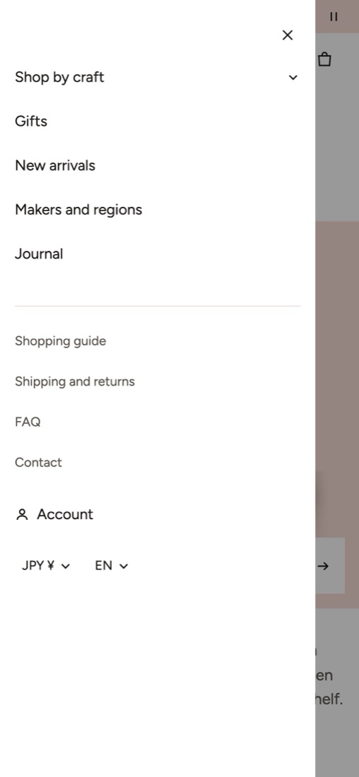 The mobile menu open: the main menu, the secondary menu, Account, and the currency and language selectors stacked in a drawer