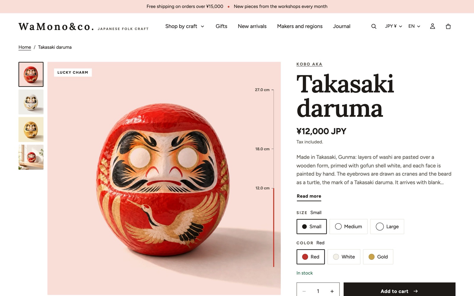 Kyoto の商品ページ。淡い桜色の面に立つ高崎だるまの写真、右端に 12.0 cm から 27.0 cm の大きさの定規、右側に商品名・価格・サイズと色の選択