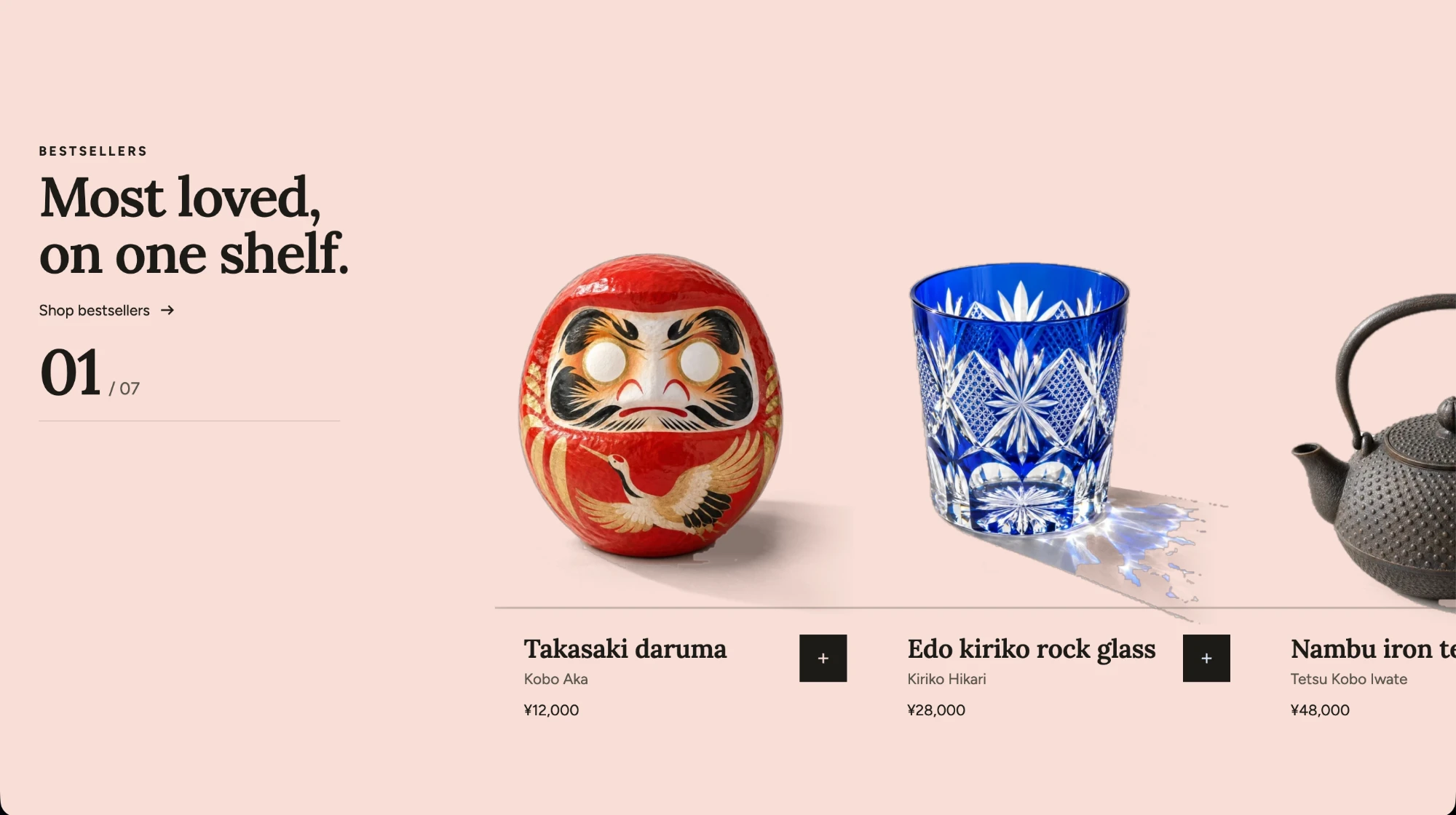 The bestsellers shelf in the Kyoto demo store: a daruma, an Edo kiriko glass and a Nambu iron kettle standing on one long shelf